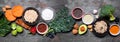 Set of healthy super food ingredients. Above view table scene on a dark slate banner background. Royalty Free Stock Photo