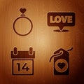 Set Heart tag, Wedding rings, Calendar with February 14 and Speech bubble with text love on wooden background