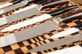 A set of high quality kitchen knives on a cutting board Royalty Free Stock Photo