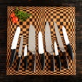 A set of high quality kitchen knives on a cutting board Royalty Free Stock Photo