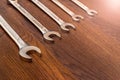 Set of horn and socket wrenches on a wooden background
