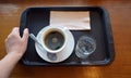 A set hot coffee cup and glass of water on the wooden table for preparing to serve Royalty Free Stock Photo