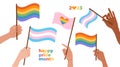 Set of human Hands holding flags with lgbt and transgender colors and hearts in the colors of the LGBT flag. Happy 2023