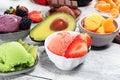 Set of ice cream scoops of different colors and flavours with berries, chocolate and fruits Royalty Free Stock Photo