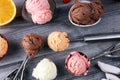 Set of ice cream scoops of different colors and flavours with berries, chocolate and fruits on background Royalty Free Stock Photo