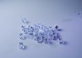 Set of ice cubes and dice falling on them Royalty Free Stock Photo