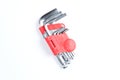 Set of imbus or Allen keys on a white background. Construction or repair tools in red plastic case Royalty Free Stock Photo