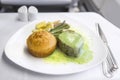 Set inflight meal steak on a tray, on a white table