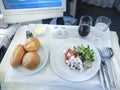 Set inflight meal on a tray, on a white table