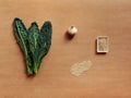 Set of ingredients for kale recipe, ail, seasame seeds, and ail Royalty Free Stock Photo