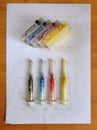 Set of Ink cartridges and dirty refill syringes Royalty Free Stock Photo