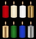 Set isolated Christmas lighted candles on black background