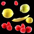 Set of isolated summer fresh fruits, berries in composition on black background. Group photo lemon, raspberry, melon isolated on w