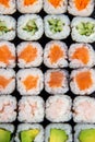 Set of japanese multi-colored sushi pieces vertical photo shot from top view with different mixed various rolls close-up Royalty Free Stock Photo