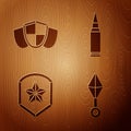 Set Japanese ninja shuriken, Shield, Police badge and Bullet on wooden background