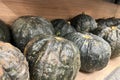 Set of Japanese Pumpkin or kabocha on the shelf of a supermarkets produce section. Royalty Free Stock Photo