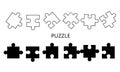 Set of jigsaw puzzle pieces in black and white with simple background Royalty Free Stock Photo