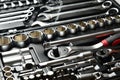 Set of keys silver chrome wrench and spanner, kit with ratchet handle and sockets, tools for repairing car in case Royalty Free Stock Photo