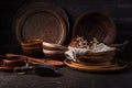 Set of kitchen ceramic and wooden tableware a table