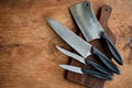 Set of kitchen knifes on wooden cutting board Royalty Free Stock Photo