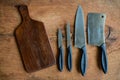 Set of kitchen knifes on wooden cutting board Royalty Free Stock Photo