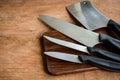 Set of kitchen knifes on wooden cutting board Royalty Free Stock Photo