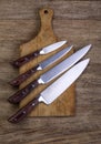 Set of kitchen knifes on wooden Royalty Free Stock Photo