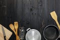 Set of kitchenware on the black wooden background Royalty Free Stock Photo