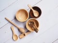 Set of kitchenware wooden with spoon, wooden cup bowl and dripper honey stick on wooden Royalty Free Stock Photo