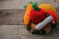 Set of knitted toys lemon, carrot, apple, amanita on wooden background. Earlier tactile development of children, craft toys