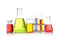 Set of lab glassware with color liquids isolated on white. Royalty Free Stock Photo