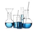 Set of laboratory glassware with blue liquid isolated on white Royalty Free Stock Photo