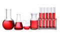 Set of laboratory glassware with red liquid on background Royalty Free Stock Photo