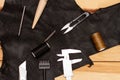 Set of leather work tools on black leather Royalty Free Stock Photo