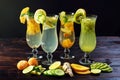Set lemonade with ice in glass hurricane with tropical fruits
