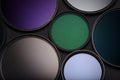 Set of lens filters for SLR camera on black background Royalty Free Stock Photo