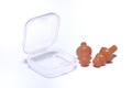 A set of light orange colored silicone ear plugs