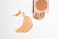 Set of liquid face powder and concealer brush strokes in different colour in texture, drop of skin tint serum , bronzing powder Royalty Free Stock Photo