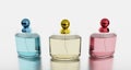 Set of Luxuary Perfume bottle. Clear bottle and Golden , Blue and pink lid on white background with reflection. 3D rendering