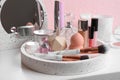 Set of luxury makeup products and perfumes on table Royalty Free Stock Photo