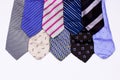 Set of luxury men's classic ties of different shapes and colors  red blue violet  isolated on a white background Royalty Free Stock Photo