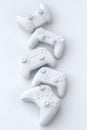 Set of lying gamer joysticks or gamepads on monochrome background