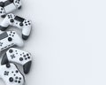 Set of lying gamer joysticks or gamepads on white background