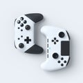 Set of lying gamer joysticks or gamepads on white background