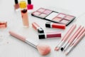 Set of makeup brushes and cosmetic products on table Royalty Free Stock Photo