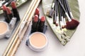 Set of makeup brushes and cosmetic products on table Royalty Free Stock Photo
