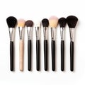A set of makeup brushes neatly arranged in a row, showcasing different types for various cosmetic applications Royalty Free Stock Photo