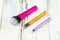 Set makeup brushes on rustic wooden table. Royalty Free Stock Photo