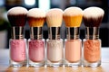 A set of makeup and cosmetic brushes in a colored jars on the table