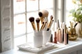 A set of makeup and cosmetic brushes in a colored jars on the table